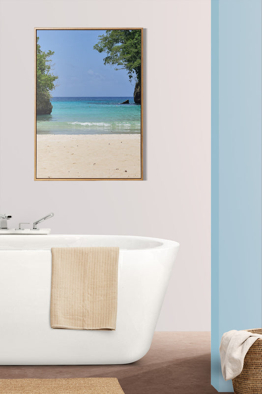 A photo of the Caribbean Sea from the beach at Frenchman's Cove in Portland, Jamaica in the bathroom above the tub.