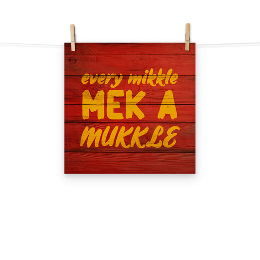 Digital wall art of the words "every mikkle mek a mukkle" painted on wood, a common Jamaican colloquialism meaning every little bit adds to up something bigger.