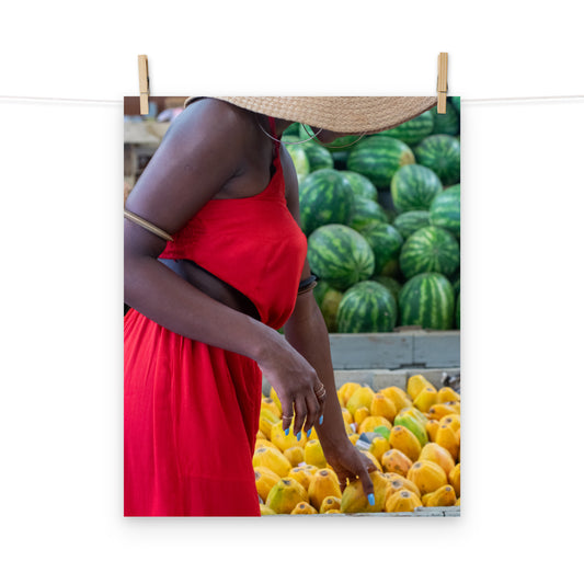 A vibrant photo of a woman shopping for tropical fruits at Coronation Market, Kingston, Jamaica.